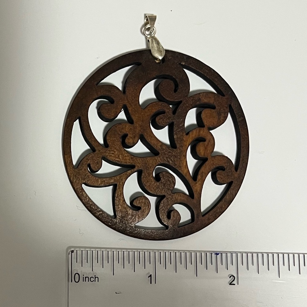 Brown Circular Wooden Pendant with Carved Swirl Design, NWOT.